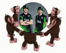 a group of monkeys are standing in a circle with two men wearing shirts that say stake