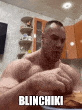 a shirtless man is eating a piece of food with the words blinchiki above him