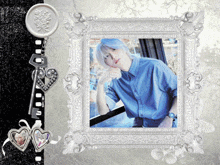 a picture of a man in a blue shirt is in a frame with a key