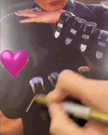 a person is drawing a picture of a woman with a pink heart behind them