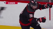 a hockey player with the number 20 on his jersey is on the ice