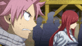 a girl with red hair is standing next to a guy with pink hair