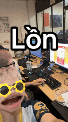 a man wearing sunglasses has the word lon written on his head