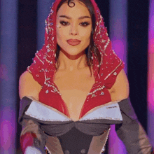 a woman wearing a red scarf around her head and a very plunging top