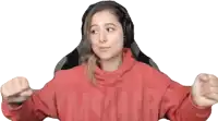 a woman wearing headphones and a red sweatshirt that says ' victoria ' on it
