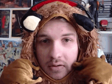 a man is wearing a lion costume and headphones on his head