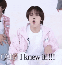 a young man in a pink jacket says omg i knew it