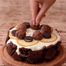 a cake with oreos and chocolate balls on top