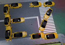 a row of yellow cars are arranged in the shape of the letter e.