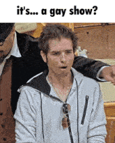 a man with a surprised look on his face and the words it 's a gay show below him