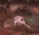a horse with pink paint on its back is laying on its back