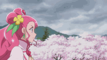 a girl with pink hair and a yellow flower in her hair stands in front of a field of cherry blossoms