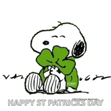a cartoon of snoopy wearing a green bow tie and sweater .