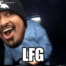 a man wearing a beanie and a blue shirt with the word lfg on the bottom