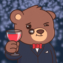 a teddy bear in a suit and bow tie holds a glass of red wine