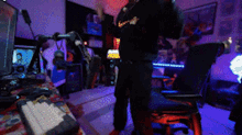 a man wearing a black nike shirt is standing in a room