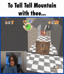 a man playing a video game with the caption to tall tall mountain with thee ...
