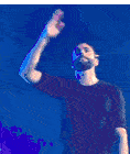 a man is standing on a stage with his back to the camera .