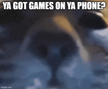 a blurry picture of a cat with the words ya got games on ya phone