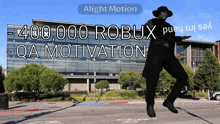 a man is dancing in front of a building that says ' alight motion - 400,000 robux qa motivation '