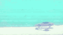 a car is driving on a beach with a blue sky in the background .