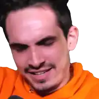a close up of a man 's face wearing an orange shirt