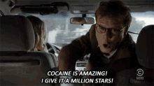 a man in a car says cocaine is amazing and give it a million stars