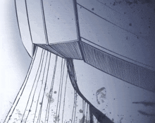 a blue and white drawing of a building with lines and spots