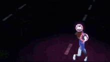 a purple lightning bolt is coming from a building in the dark .