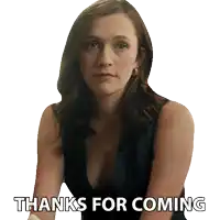 a woman says " thanks for coming " while sitting down
