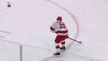 a hockey goalie is kneeling down in front of a net that says bauer