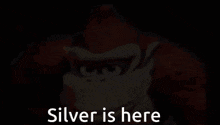 donkey kong is smiling with the words silver is here below him