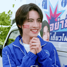 a man wearing a blue jacket with a sticker on his face that says ' johnson ' on it