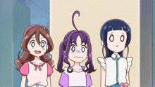 three cartoon girls are standing next to each other and one of them has a purple ponytail