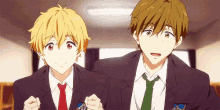 two anime boys in suits and ties are standing next to each other in a hallway .