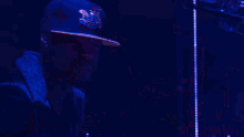 a crowd of people at a concert with their hands up