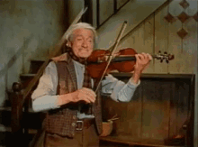 Darby O Gill Playing Violin GIF - Darby O Gill Playing Violin Violin GIFs