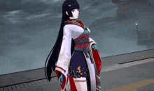 a girl with long black hair wearing a white and red kimono