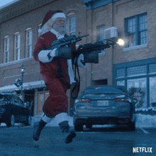 Santa Claus Shooting Merry Christmas GIF - Santa Claus Shooting Merry Christmas Happy Holidays GIFs