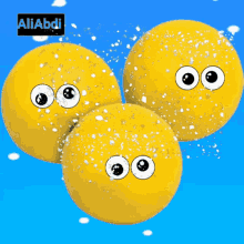 three yellow balls with googly eyes and the name aliabdi