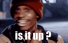 a man wearing a red beanie is asking is it up ?