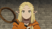 a girl with blonde hair is holding a whip in her hand