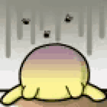 a yellow and purple cartoon character is laying on a table with a white background .