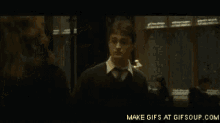 a gif of harry potter and hermione granger dancing
