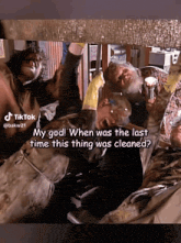 a group of men are working under a pipe and one of them says " my god "