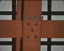 a close up of a wooden fence with a square in the middle .