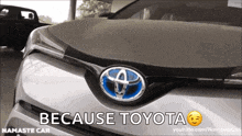 a toyota car with the words " because toyota " on the bottom