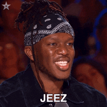 a man wearing a bandana says jeez in front of a crowd of people