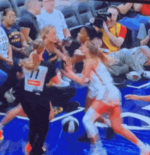 a basketball game is being played with a referee wearing number 1