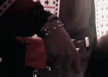 a close up of a person 's hand wearing a bracelet and ring .